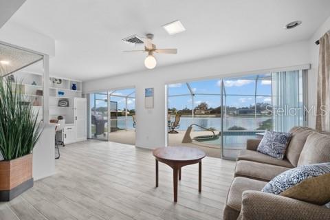 437 Hickory Road Venice, FL 34293 - Photo 8 of 33 a living room with furniture and a large window