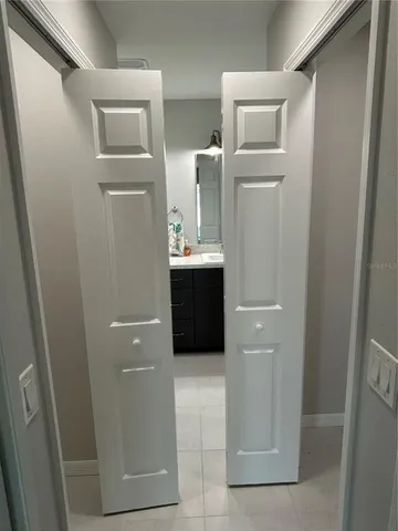 a bathroom with a sink and mirror