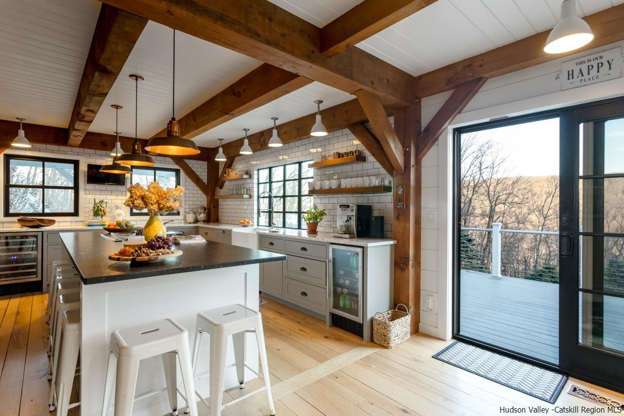 21 Red Oak Lane Garrison, NY 10524 - Photo 12 of 35 a kitchen with a sink a window and cabinets
