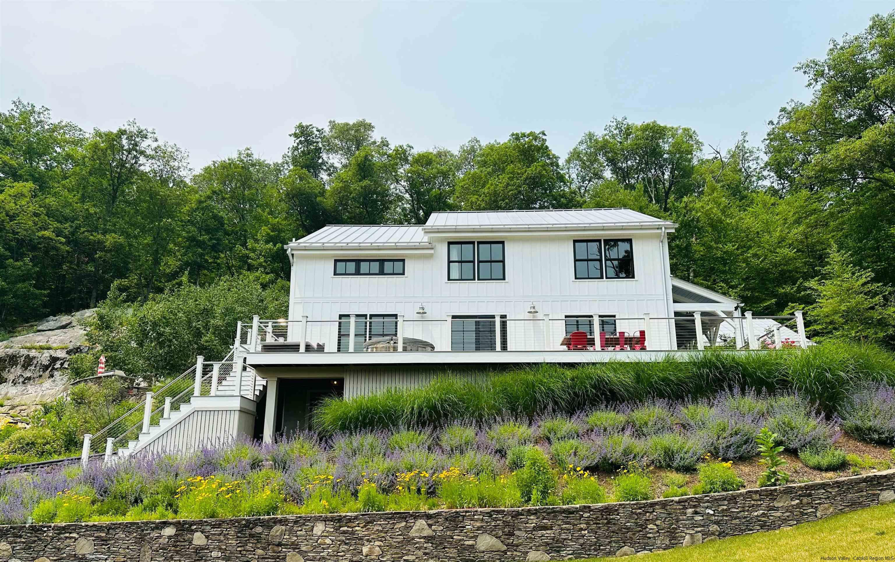 21 Red Oak Lane Garrison, NY 10524 - Photo 2 of 35 a view of a house with a yard and sitting area