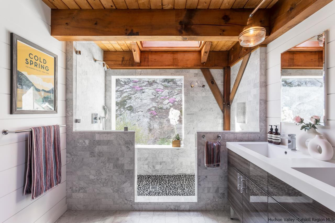 21 Red Oak Lane Garrison, NY 10524 - Photo 21 of 35 a bathroom with a sink a mirror and next to a window