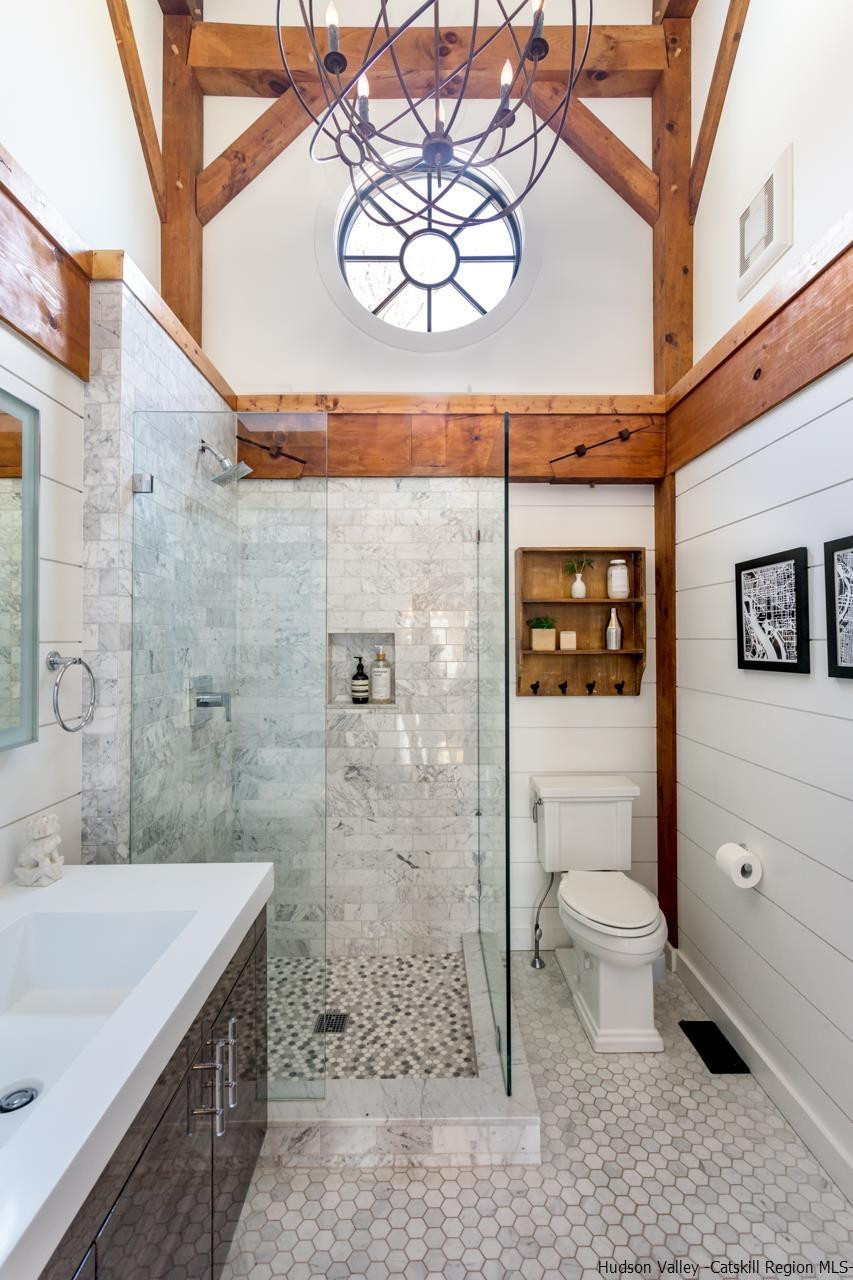 21 Red Oak Lane Garrison, NY 10524 - Photo 25 of 35 a bathroom with a sink a toilet and shower