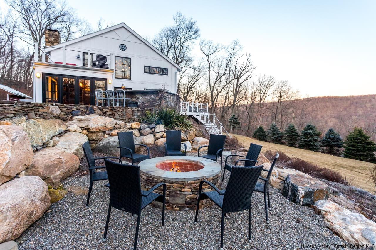 21 Red Oak Lane Garrison, NY 10524 - Photo 32 of 35 a view of a patio with furniture and a yard