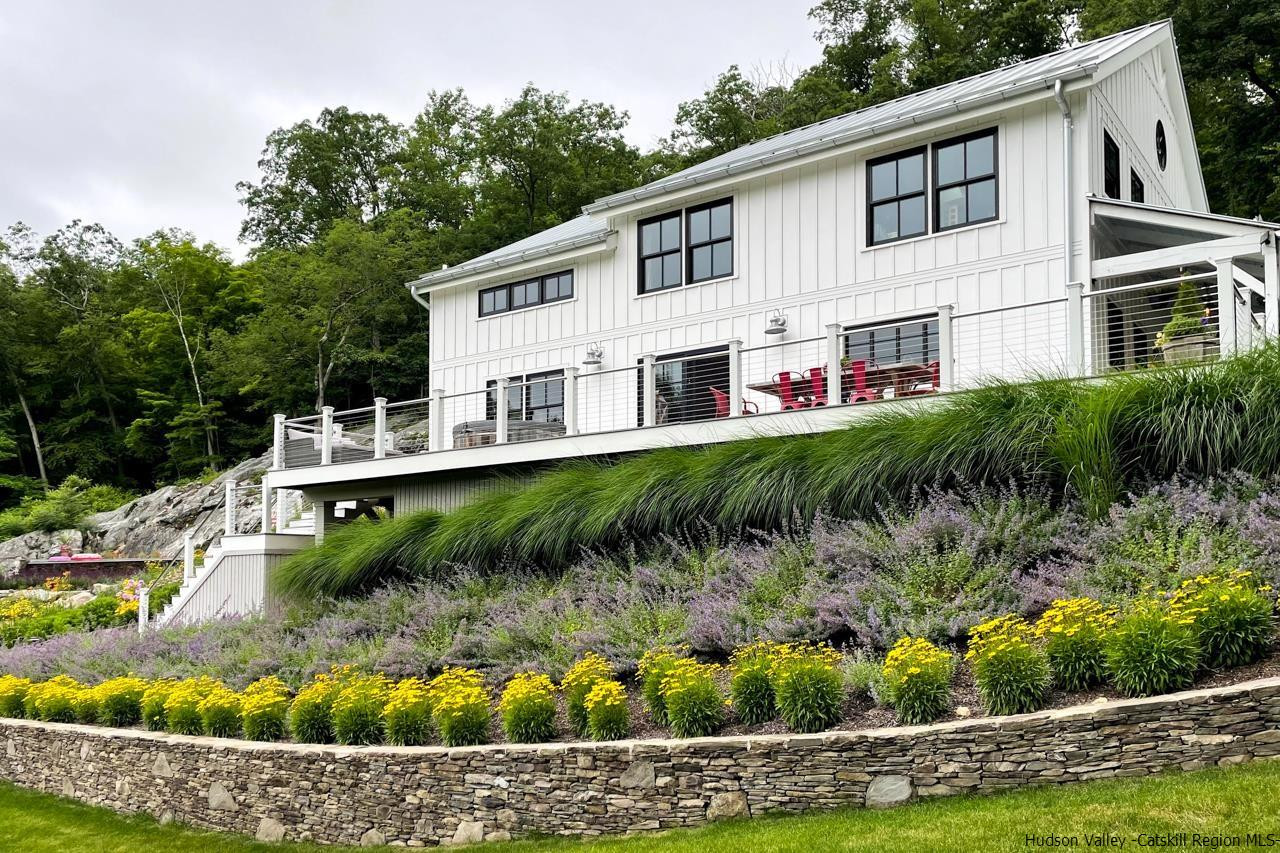 21 Red Oak Lane Garrison, NY 10524 - Photo 35 of 35 a view of a house with a yard and potted plants