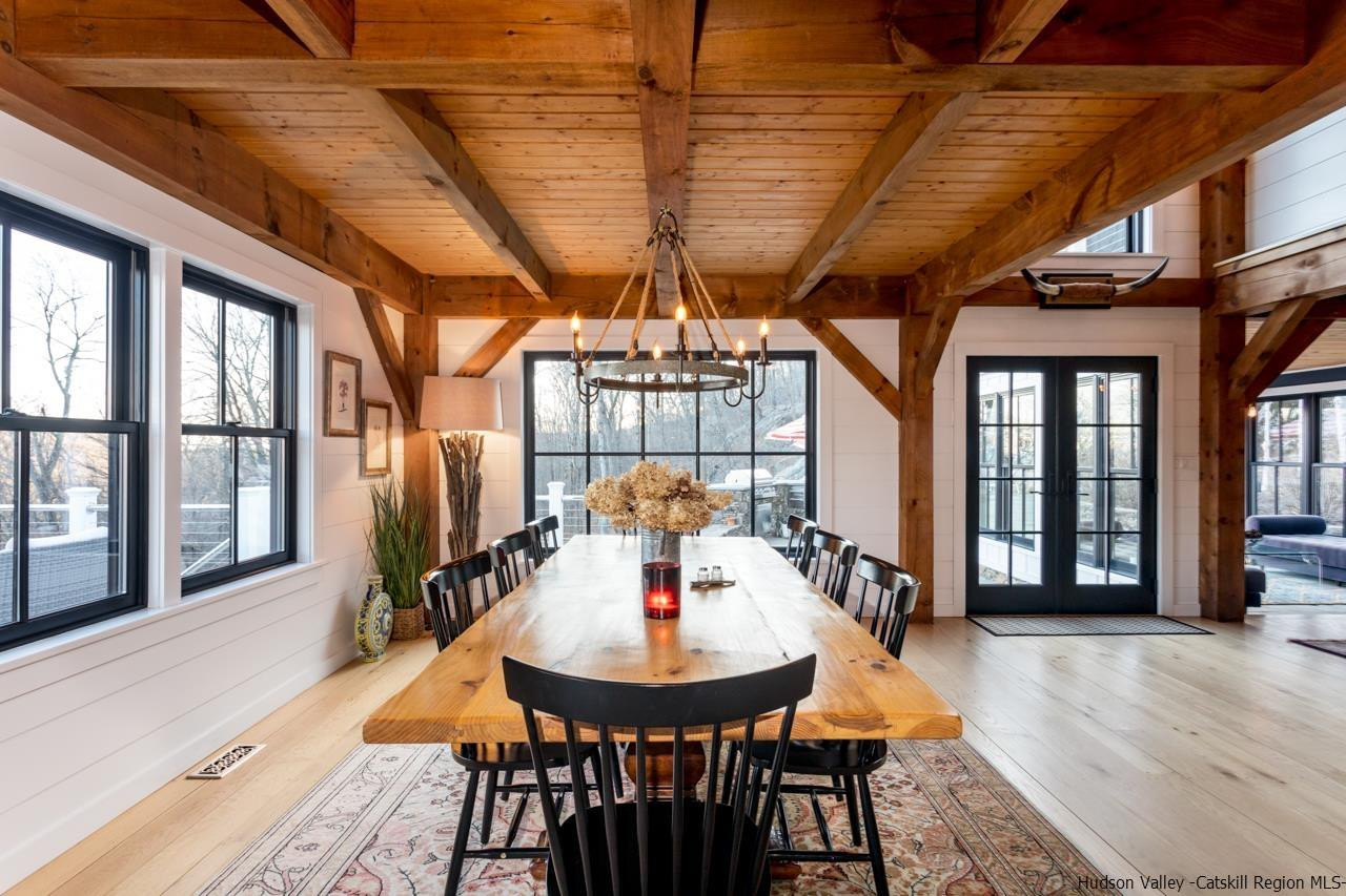 21 Red Oak Lane Garrison, NY 10524 - Photo 10 of 35 a dining room with furniture a chandelier and wooden floor