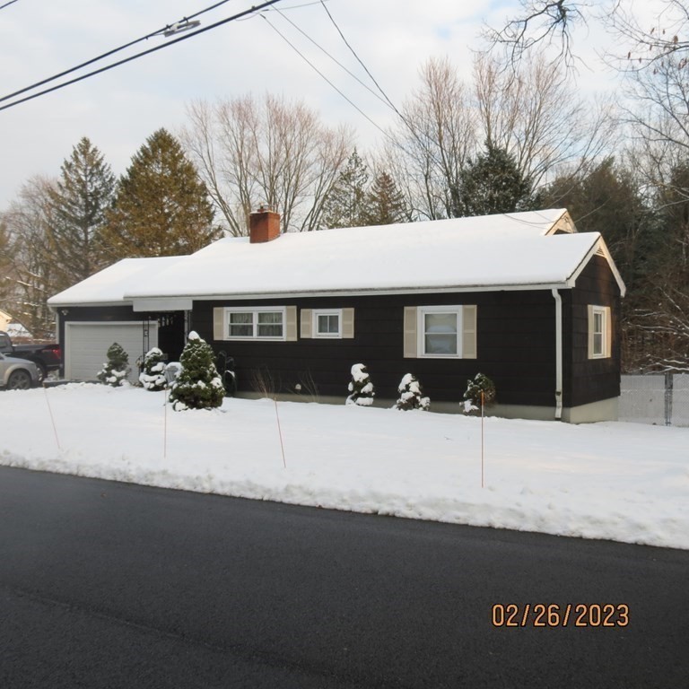 17 Bowl Road Chelmsford, MA 01824 - Photo 1 of 30 a front view of a house with a yard