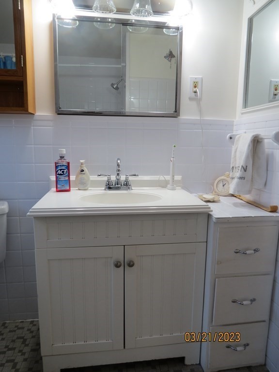 17 Bowl Road Chelmsford, MA 01824 - Photo 11 of 30 a bathroom with a sink vanity and a mirror
