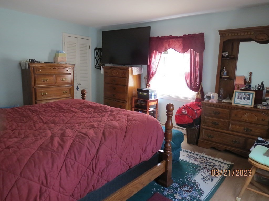 17 Bowl Road Chelmsford, MA 01824 - Photo 13 of 30 a bedroom with a bed and wooden floor