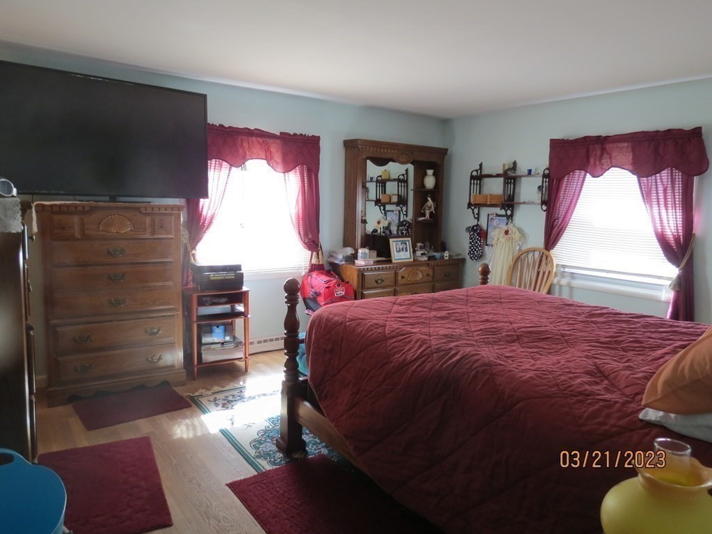 17 Bowl Road Chelmsford, MA 01824 - Photo 14 of 30 a bed sitting in a bedroom next to a window