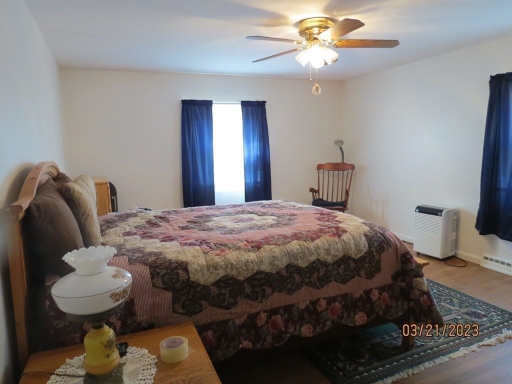 17 Bowl Road Chelmsford, MA 01824 - Photo 15 of 30 a bedroom with a bed and chandelier
