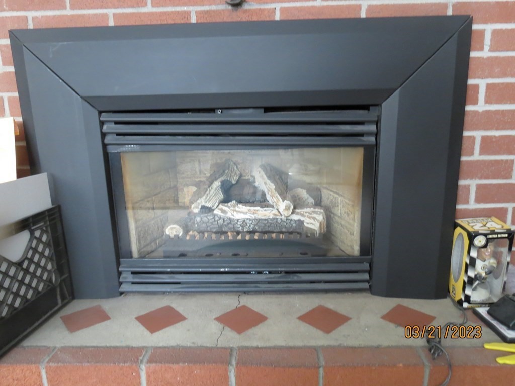 17 Bowl Road Chelmsford, MA 01824 - Photo 17 of 30 a view of fireplace and wooden floor