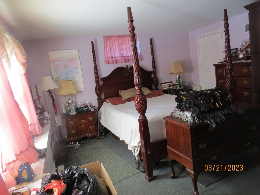 17 Bowl Road Chelmsford, MA 01824 - Photo 18 of 30 a bed room with a bed and a chandelier