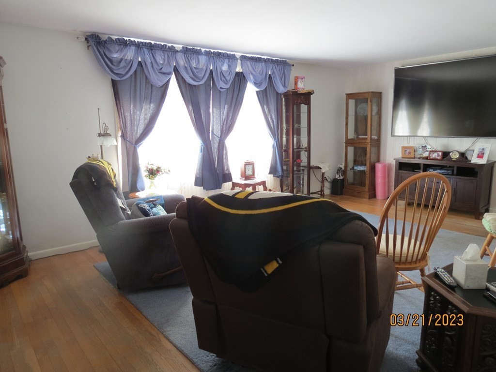 17 Bowl Road Chelmsford, MA 01824 - Photo 3 of 30 a living room with furniture and a flat screen tv