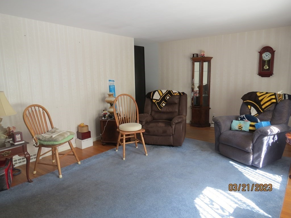 17 Bowl Road Chelmsford, MA 01824 - Photo 4 of 30 a living room with furniture and a chair