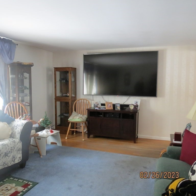 17 Bowl Road Chelmsford, MA 01824 - Photo 5 of 30 a living room with furniture and a flat screen tv