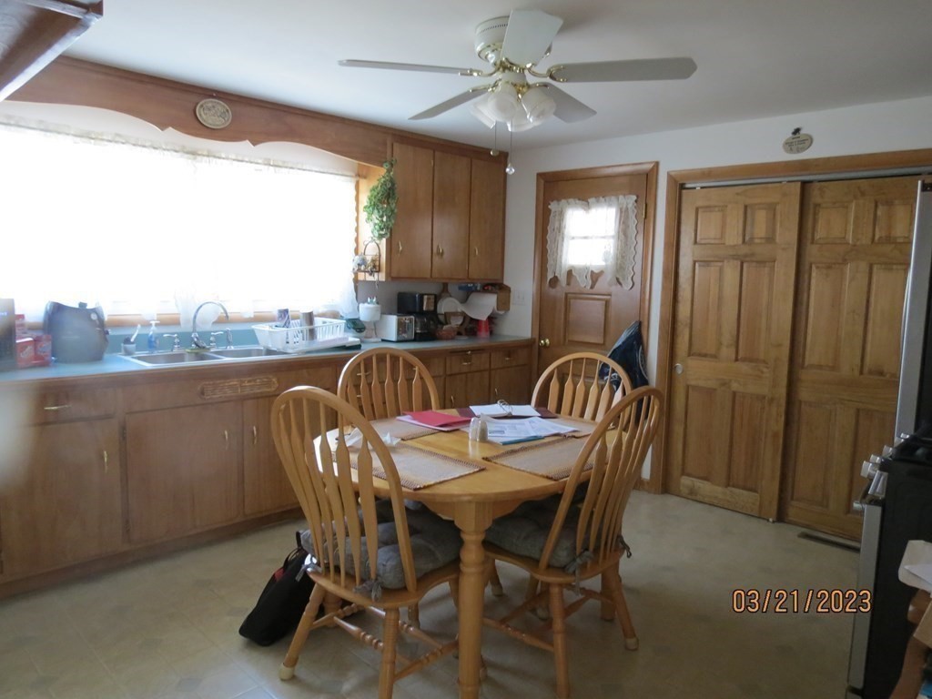 17 Bowl Road Chelmsford, MA 01824 - Photo 6 of 30 a view of a a dining room with furniture window and outside view