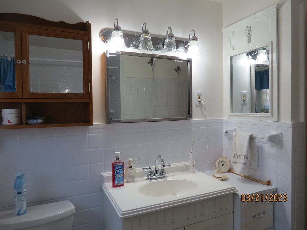17 Bowl Road Chelmsford, MA 01824 - Photo 10 of 30 a bathroom with a sink and a mirror