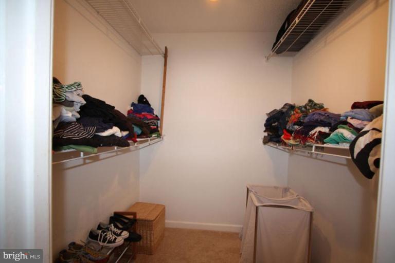 1045 31st Street Northwest, Unit 202 Washington, DC 20007 - Photo 1 of 21 a view of a closet and a utility room