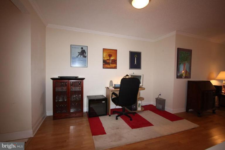 1045 31st Street Northwest, Unit 202 Washington, DC 20007 - Photo 16 of 21 a view of a workspace with furniture and gym equipment