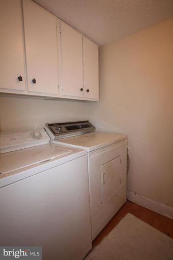 1045 31st Street Northwest, Unit 202 Washington, DC 20007 - Photo 19 of 21 a utility room with dryer and washer