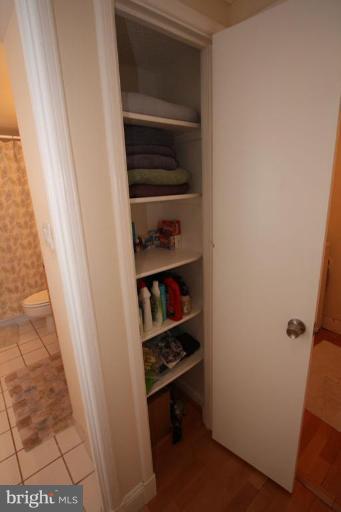 1045 31st Street Northwest, Unit 202 Washington, DC 20007 - Photo 10 of 21 a room with walk in closet and a window
