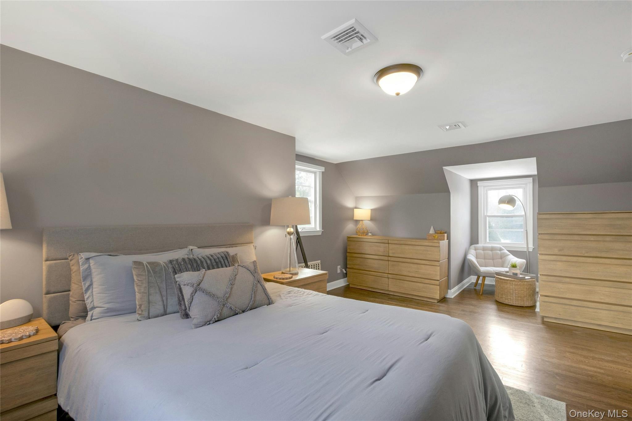 59 Sylvan Road Port Chester, NY 10573 - Photo 16 of 35 Plenty of natural light pours into the bedroom. Space for multiple dressers and a cute reading nook are across from the king bed.