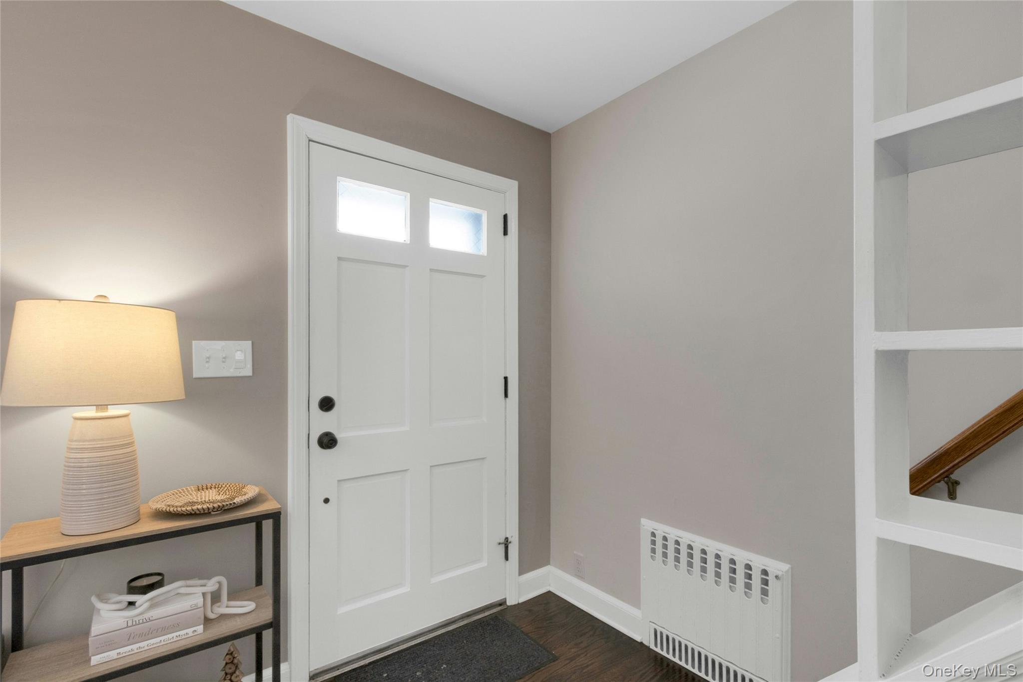 59 Sylvan Road Port Chester, NY 10573 - Photo 2 of 35 A charming entry with an original radiator detail that adds warmth and architectural character