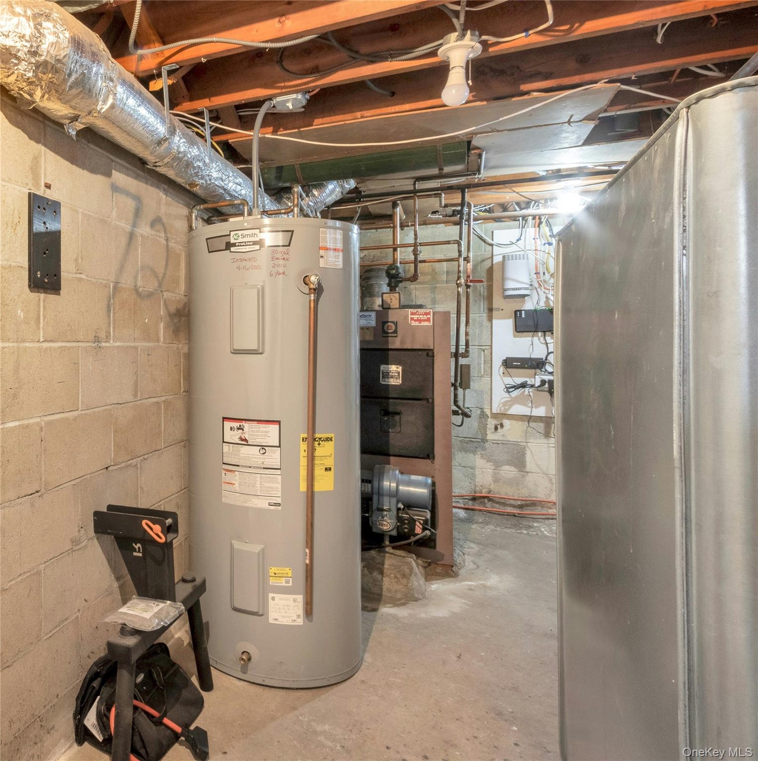59 Sylvan Road Port Chester, NY 10573 - Photo 25 of 35 Utility room with electric water heater
