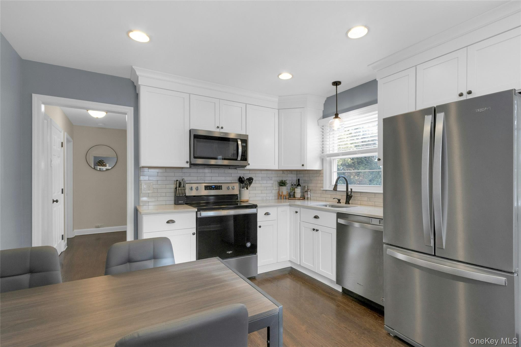 59 Sylvan Road Port Chester, NY 10573 - Photo 6 of 35 The large eat in kitchen has enough room for a dining table for everyday meals and hosting. Plenty of space in the backyard for eating outside in the summer, too!