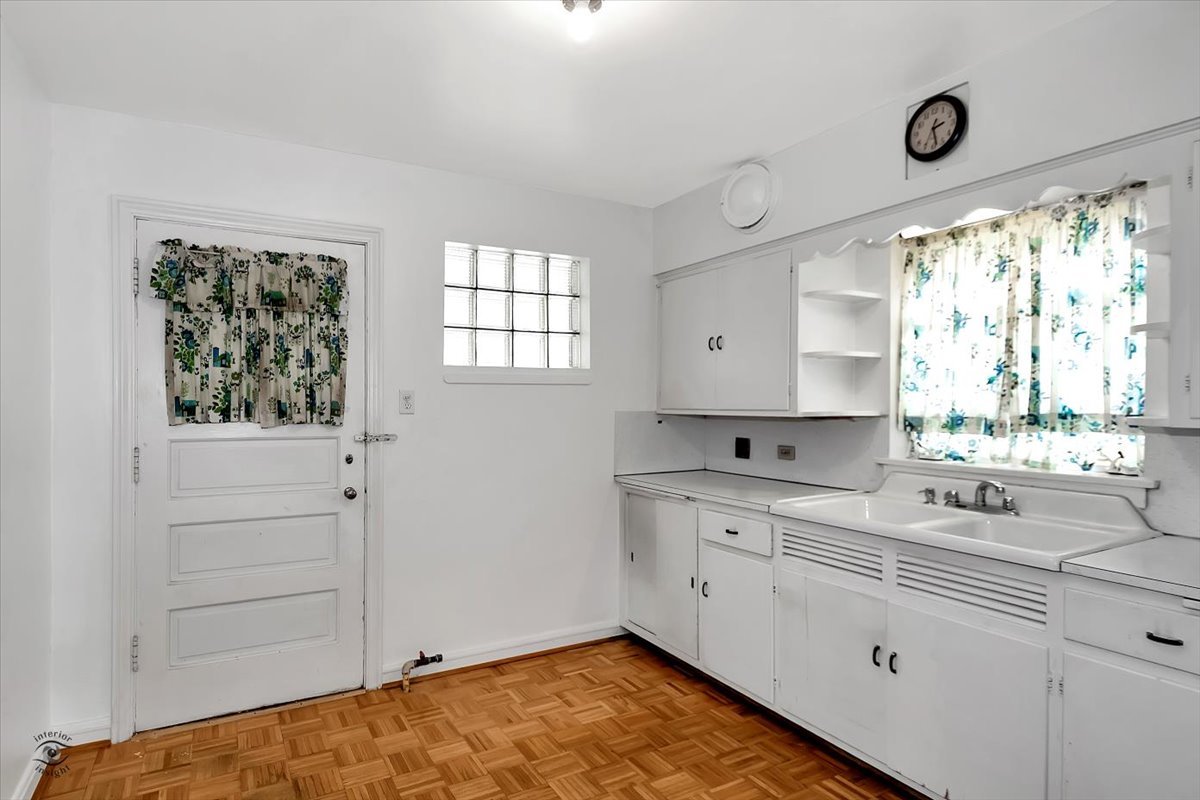 9527 South Damen Avenue Chicago, IL 60643 - Photo 11 of 30 a kitchen with white cabinets and window