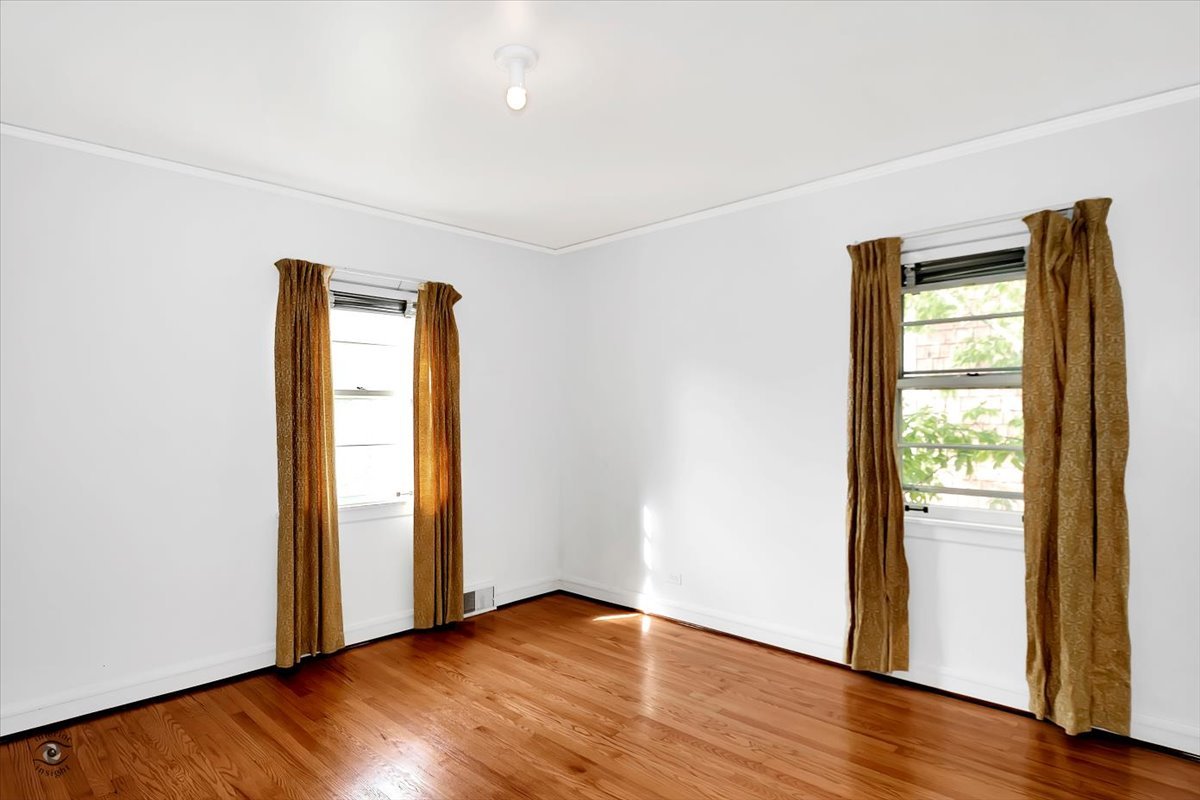 9527 South Damen Avenue Chicago, IL 60643 - Photo 21 of 30 an empty room with wooden floor and window