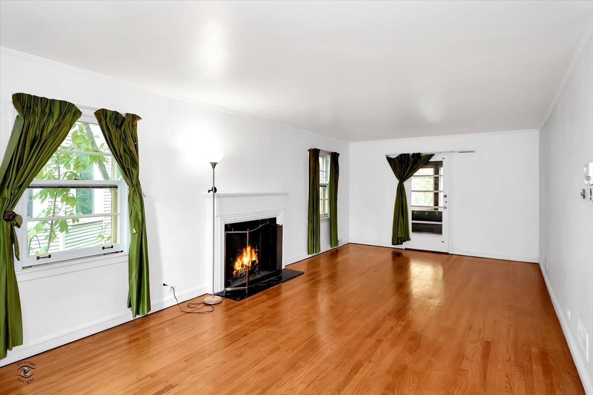9527 South Damen Avenue Chicago, IL 60643 - Photo 4 of 30 a view of empty room with fireplace and wooden floor