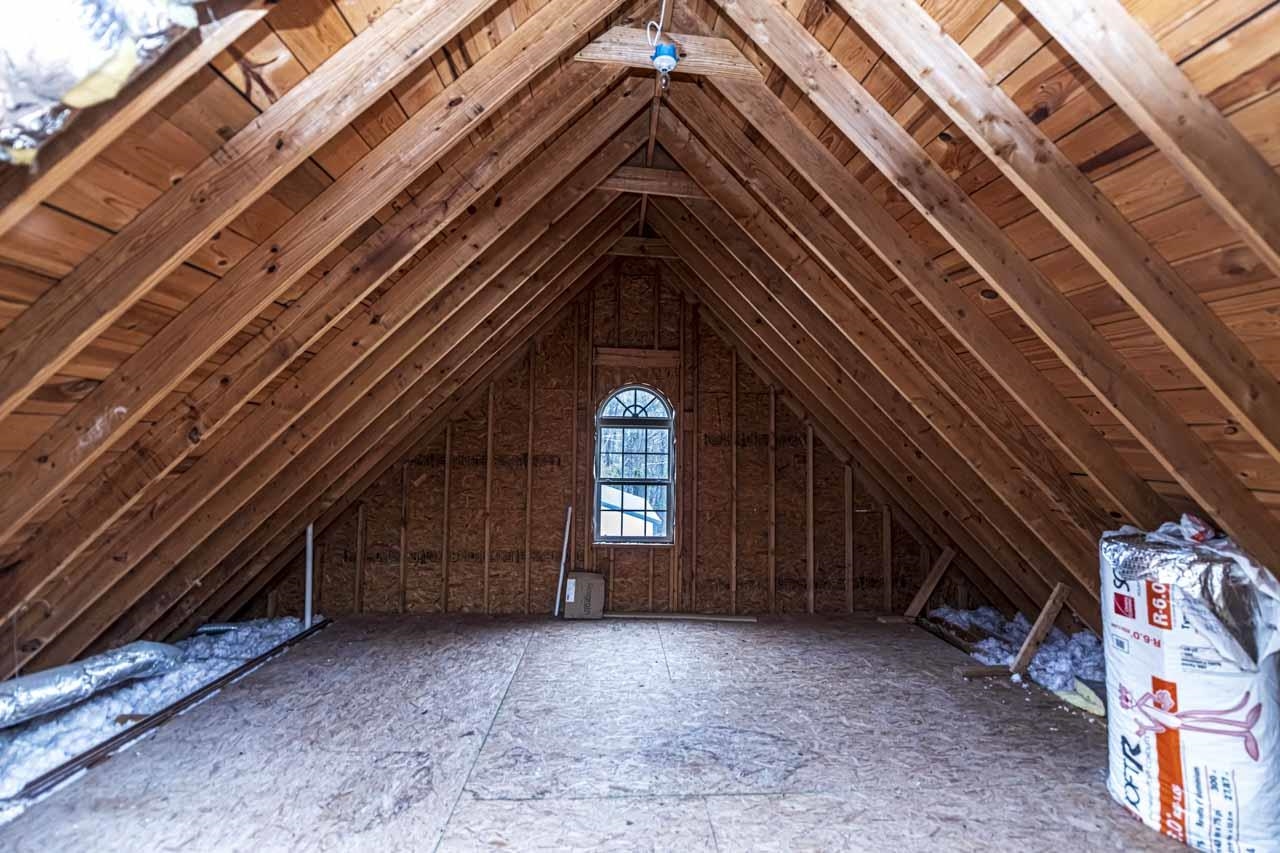 View of unfinished attic.  There are 2 large attic storage areas.