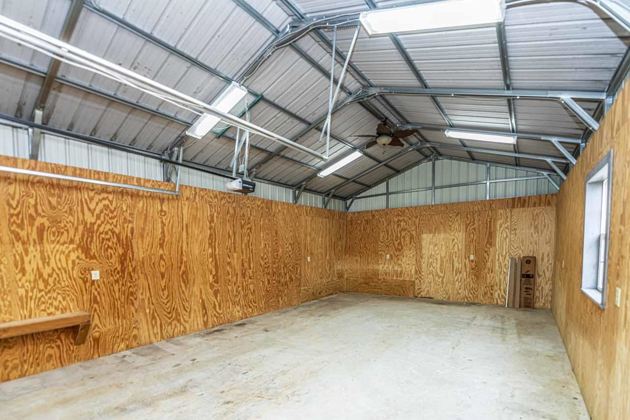3876 West Union Road Millington, TN 38053 - Photo 22 of 40 Garage with metal wall and a garage door opener