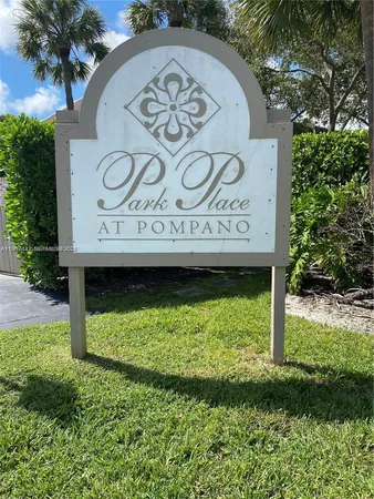 a view of sign board with yard