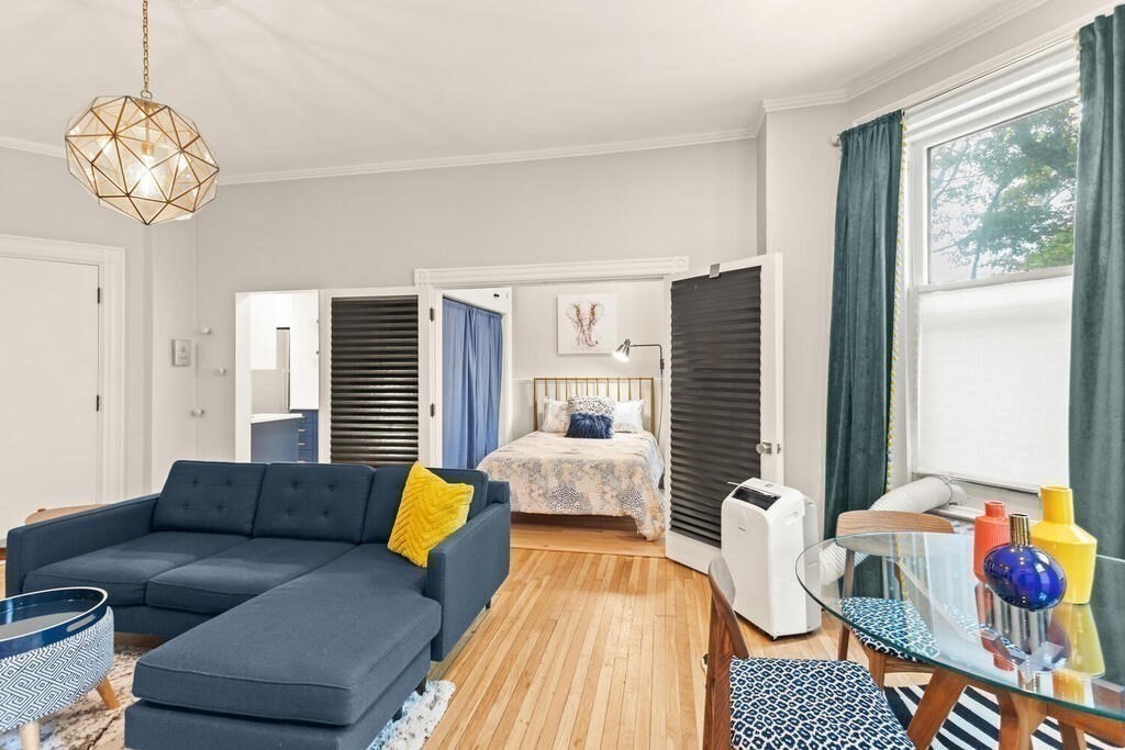 473 Beacon Street, Unit 5 Boston, MA 02115 - Photo 5 of 21 a living room with furniture and wooden floor