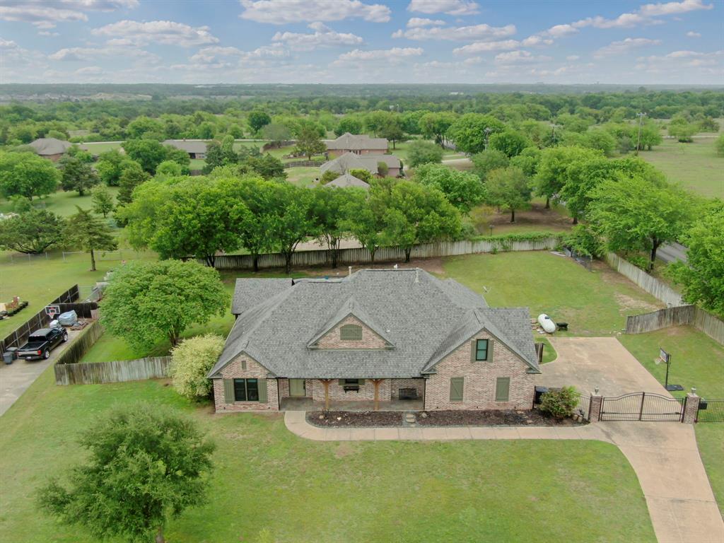 3052 Keri Lane Midlothian, TX 76065 - Photo 2 of 40 an aerial view of a house with a garden and lake view