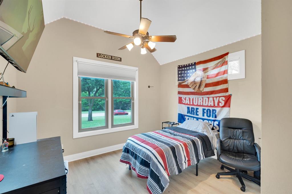 3052 Keri Lane Midlothian, TX 76065 - Photo 23 of 40 a bedroom with a bed and a desk