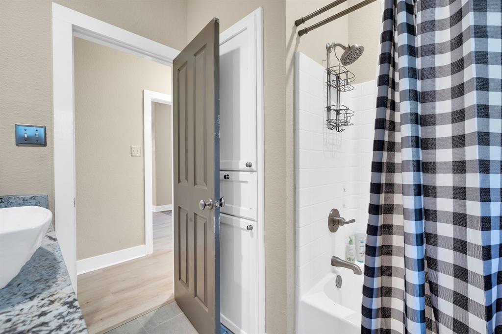 3052 Keri Lane Midlothian, TX 76065 - Photo 25 of 40 a bathroom with a sink and a shower