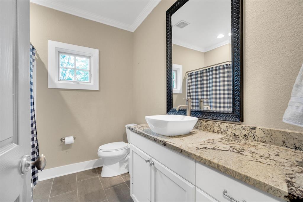 3052 Keri Lane Midlothian, TX 76065 - Photo 26 of 40 a bathroom with a granite countertop sink toilet and mirror