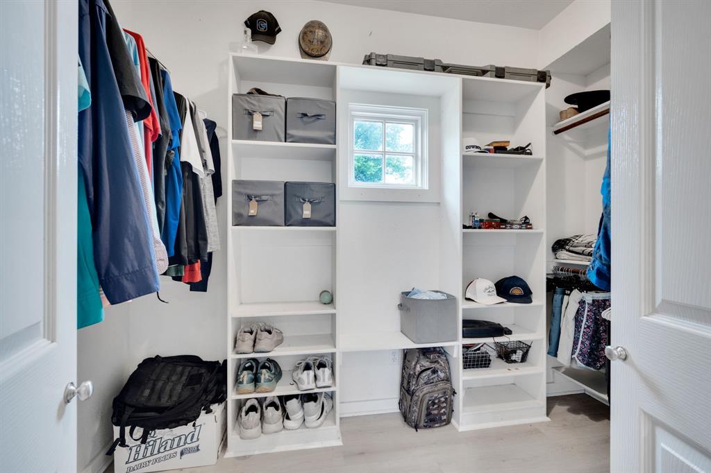 3052 Keri Lane Midlothian, TX 76065 - Photo 29 of 40 a view of walk in closet with clothes and shoes