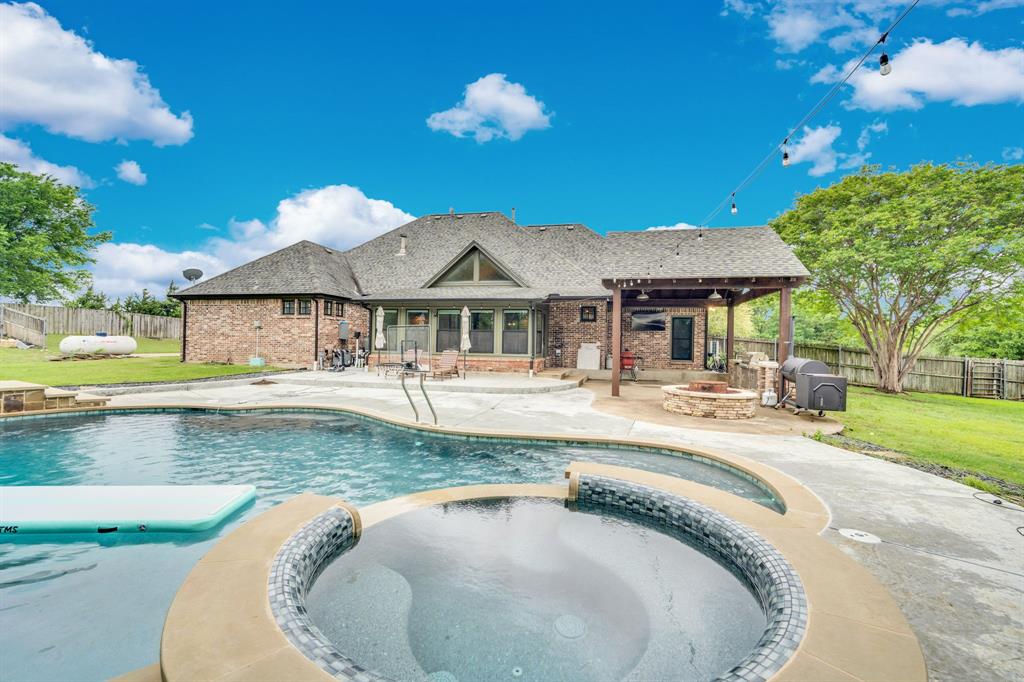 3052 Keri Lane Midlothian, TX 76065 - Photo 3 of 40 a view of a house with swimming pool and a yard