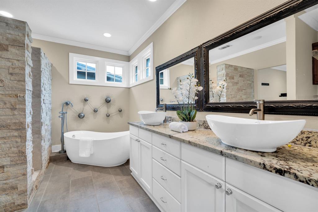 3052 Keri Lane Midlothian, TX 76065 - Photo 31 of 40 a spacious bathroom with a double vanity sink a mirror and a bathtub