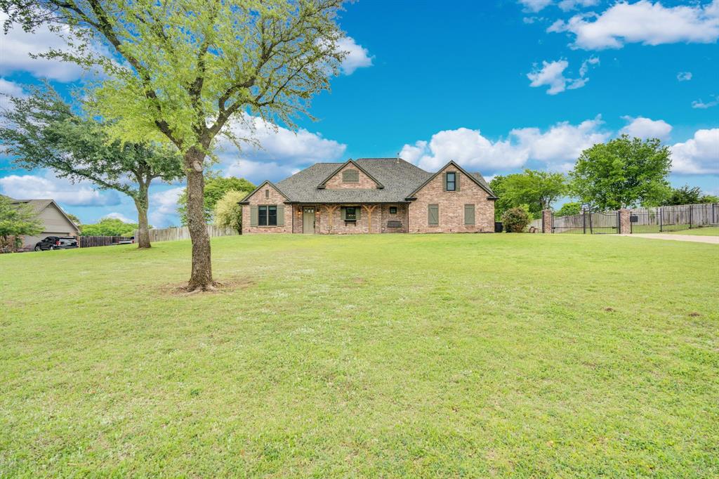3052 Keri Lane Midlothian, TX 76065 - Photo 36 of 40 a front view of a house with a big yard