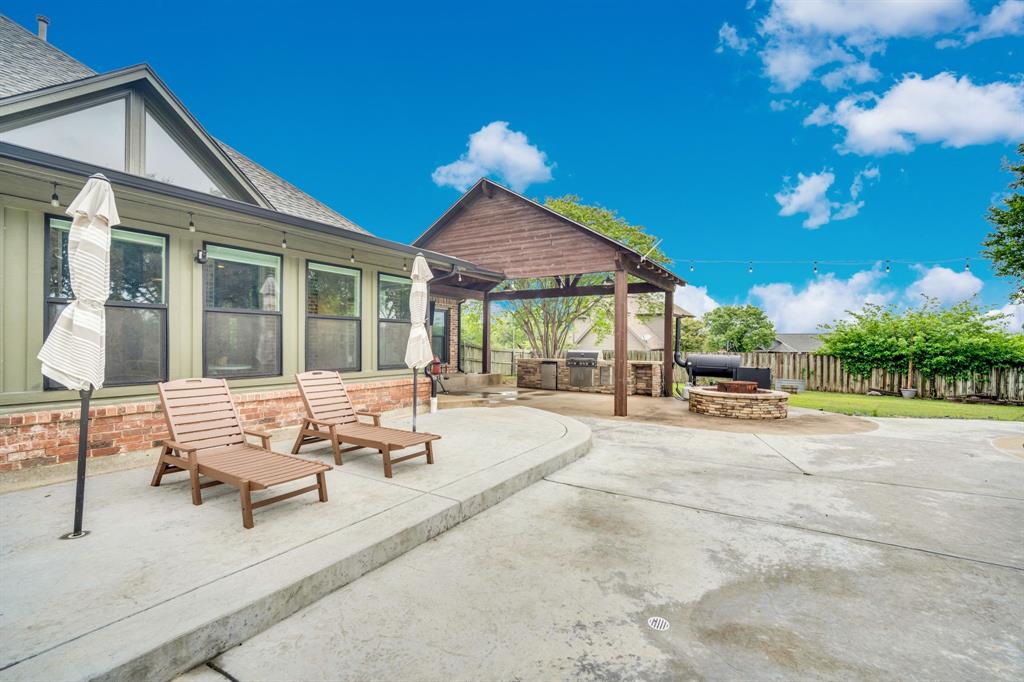 3052 Keri Lane Midlothian, TX 76065 - Photo 6 of 40 a building outdoor space with patio furniture and potted plants