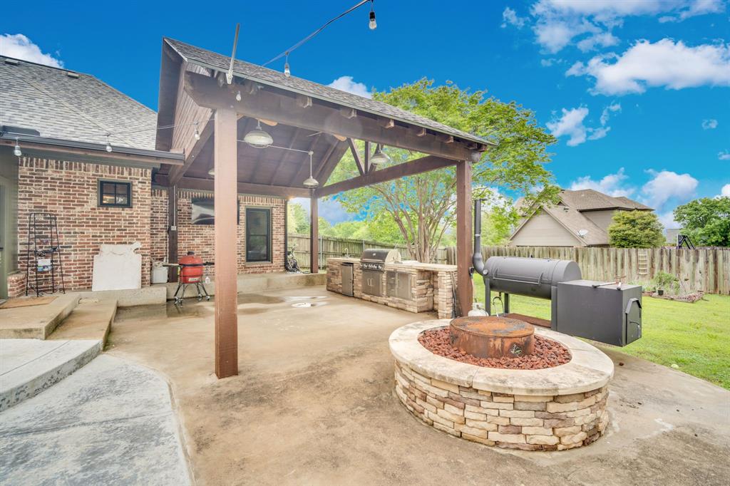 3052 Keri Lane Midlothian, TX 76065 - Photo 7 of 40 a view of a house with a backyard porch and sitting area