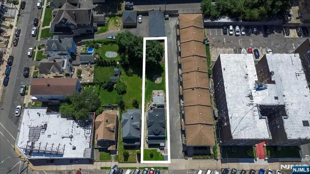 an aerial view of houses with outdoor space