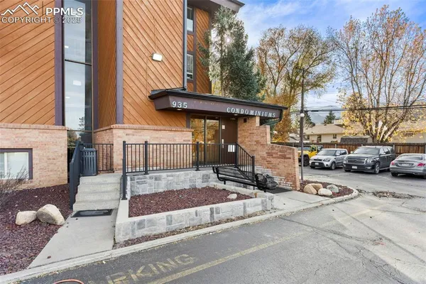a view of a car park in front of house