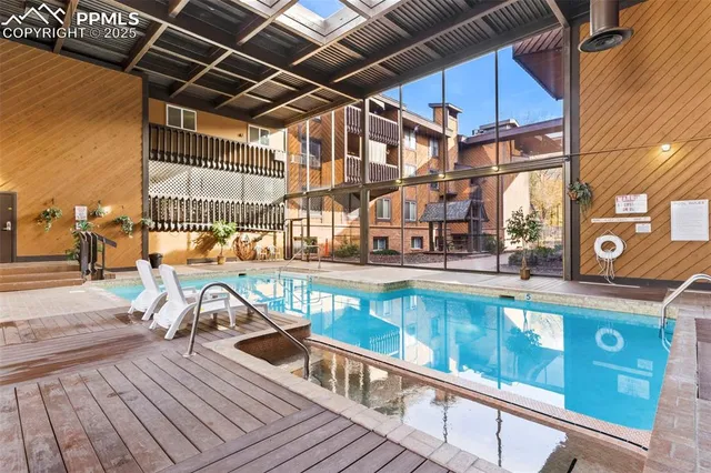 a view of a swimming pool with a patio