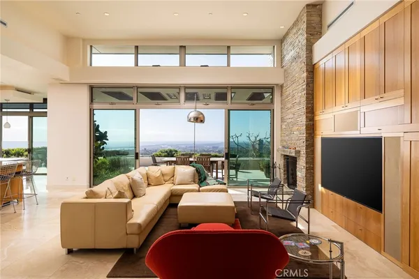 a living room with fireplace furniture and a flat screen tv